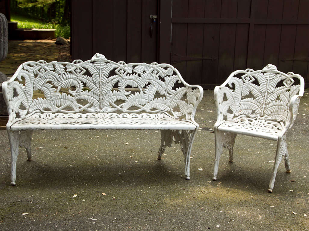Fern patterned cast iron bench and arm chair, attributed to 