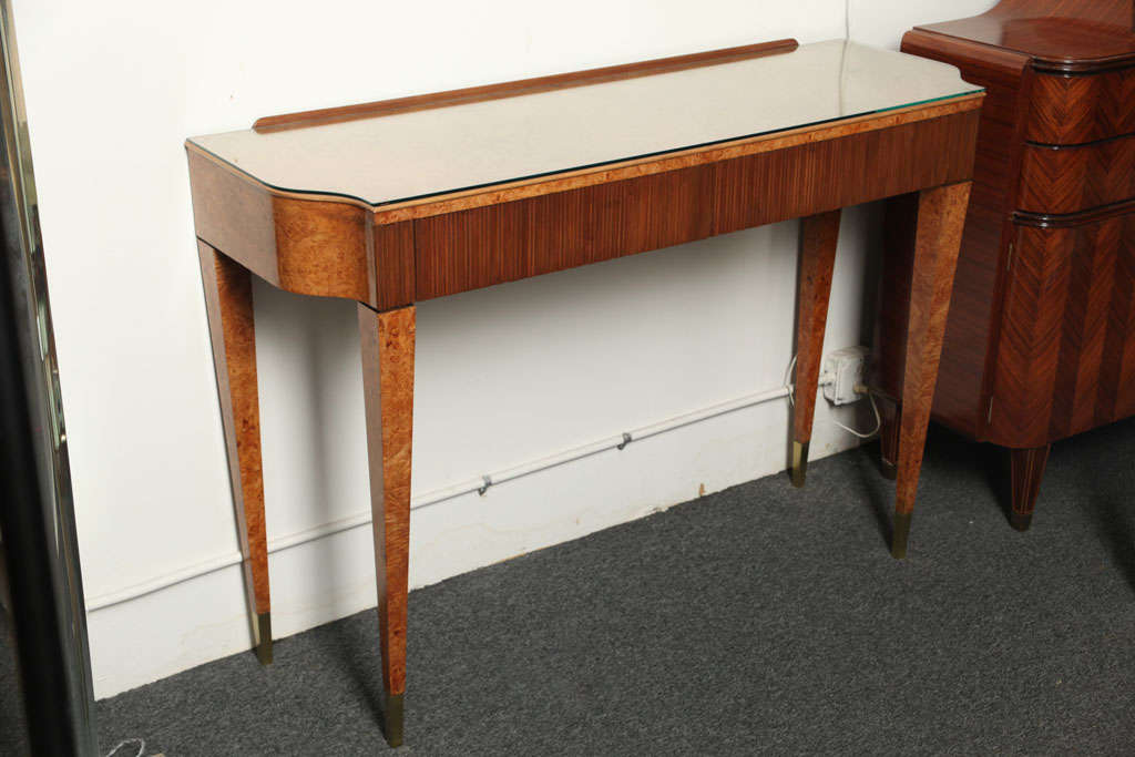 Elegant toya wood burl art deco console designed by Paolo Buffa, made in 1930 in Milan, beautiful proportions, channeled design on front of drawers on tall tapered legs with brass sabos. 