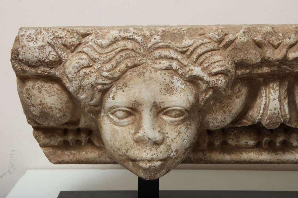 Carved Ancient Roman Marble Architrave with Two Heads For Sale
