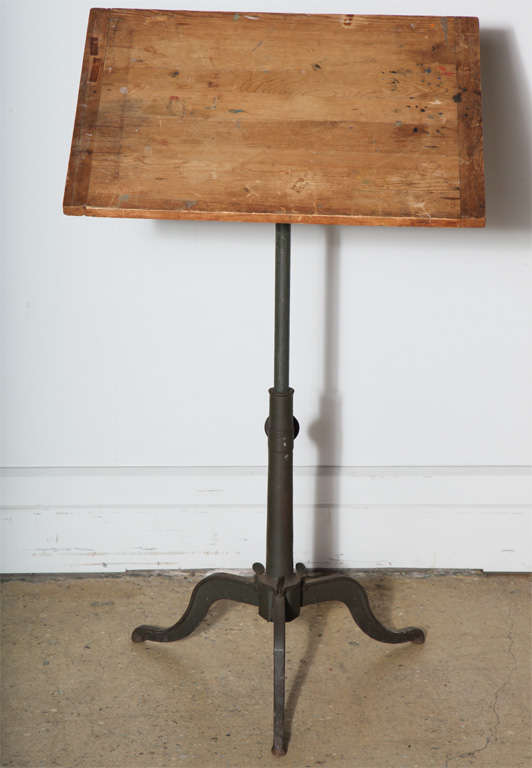Small adjustable Drafting Table with Breadboard Top on Cast Iron base.   Can be adjusted to horizontal position for Table use