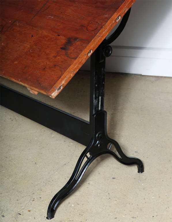 Circa 1900 very large 6 foot Double Pedestal Draughting Table on Cast Iron Legs.  Fantastic multi use Table - adjusts horizontally as a Dining Table
Angle adjustable from flat to 45 degrees; also adjusts up and down
