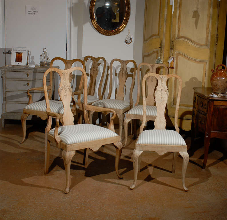 Set of Six Limed Oak French Dining Chairs including four sides and two arm chairs. These Items are Antiques. Please Refer to Our Website for Our Complete Inventory.