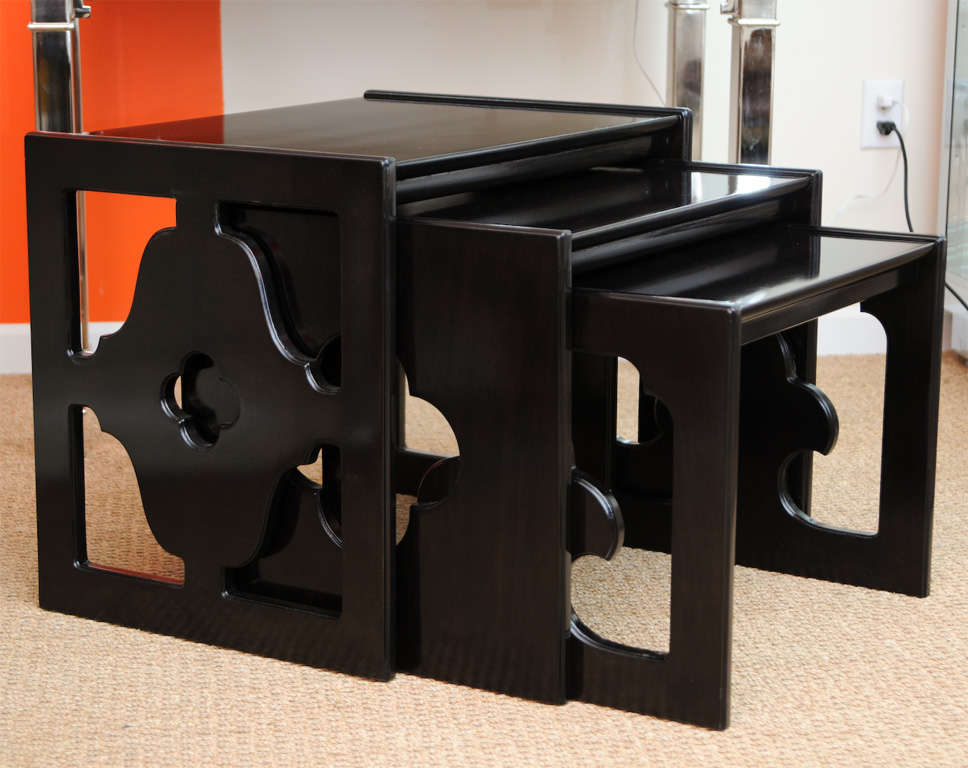 Deck of cards, clover leaf design might describe these set of 3 vintage cutout vintage wood nesting tables that have substantial weight and size. They are solid wood from the early 1960s. They have been ebonized at one time over 9 years ago. Each