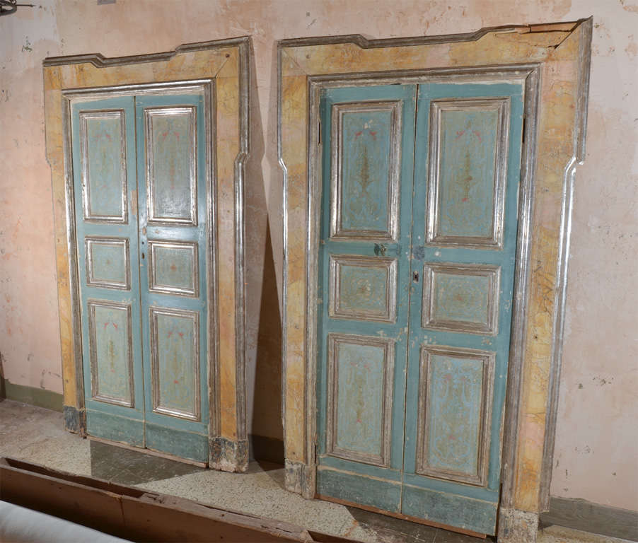 Pair of beautifully painted and silver leaf Venetian doors with painted surround.The doors are painted on the opposite side as well.