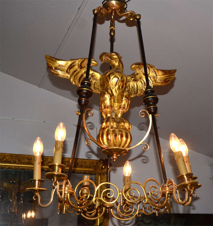 very inusual chandelier , gilt and brown patina bronze, and gilded wood  eagle. 6 lights.