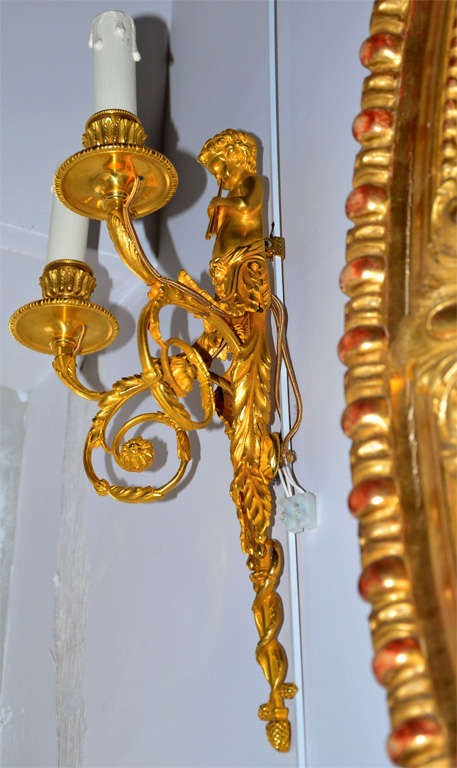 Gorgeous gilded bronze sconces, with Children playing flute  - two arms of light - 
newly electrified.  Bronze is signed DD.