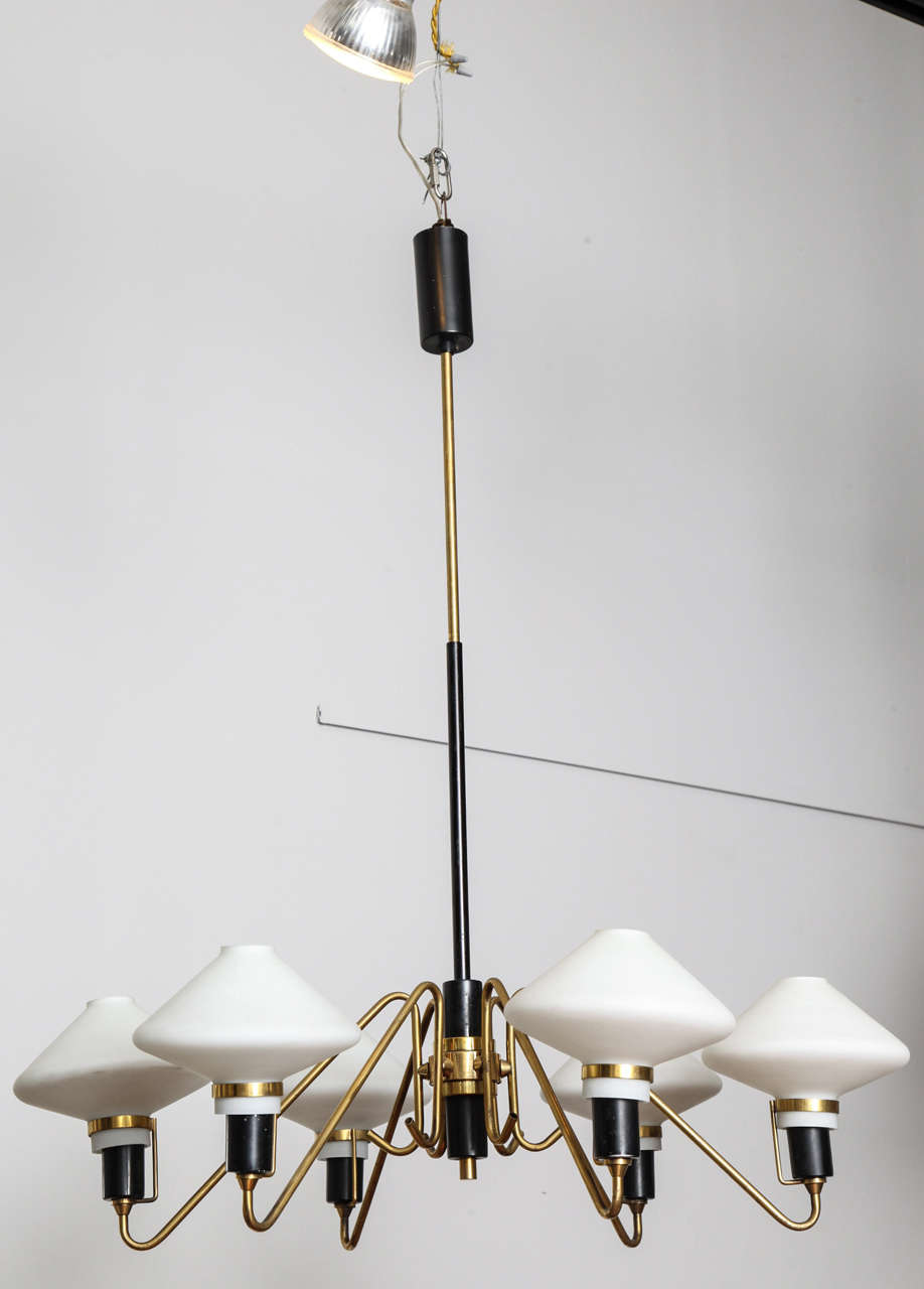 Six-arm Italian Modern chandelier. Brass and ebonized wood arms and stem with six milk glass bowls.