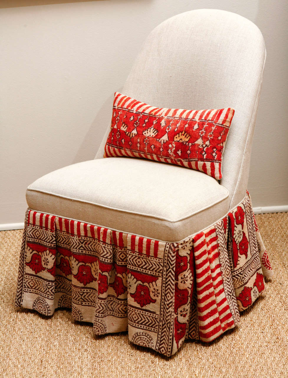 Charming small antique slipper chair upholstered in light gray linen.  Bottom ruffle is vintage hand blocked, hand painted Indian Kalamkari cotton from Gudjarat State.