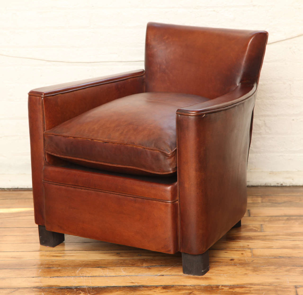 A pair of Art Deco leather club chairs.