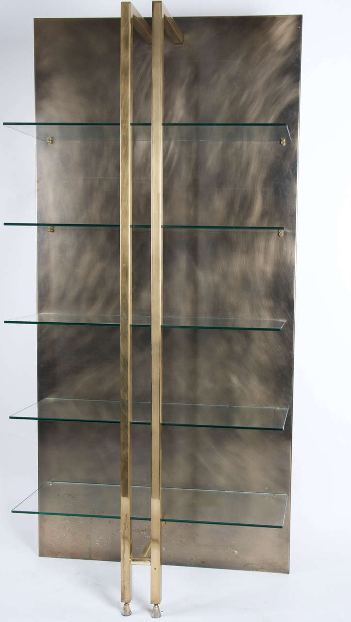 A Belgian display unit 70's in steel brass and glass shelves