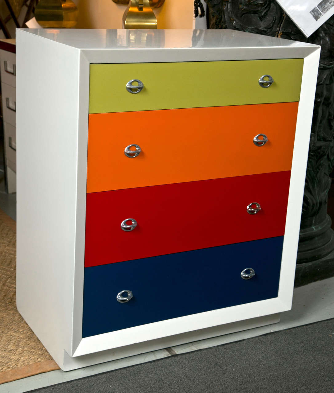 A Pair of Multi Colored Art Deco Style Bachelor Chests.