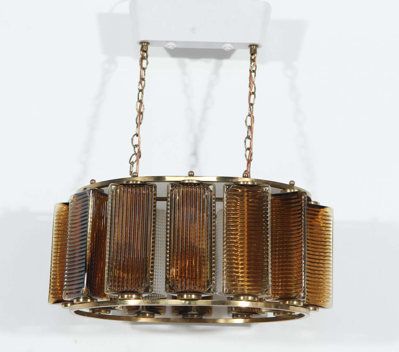 Oval Swedish ceiling light fixture. Brass core and accents, checkered clear glass, fluted brown glass. Rewired. 

