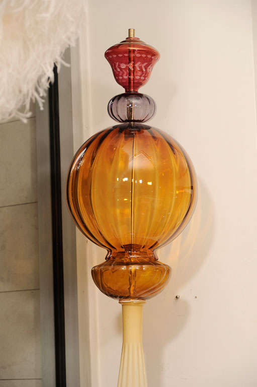 A tall, very decorative glass sculpture made by glass from the 1920's-1960's.<br />
Corbett Reynolds is the artist.