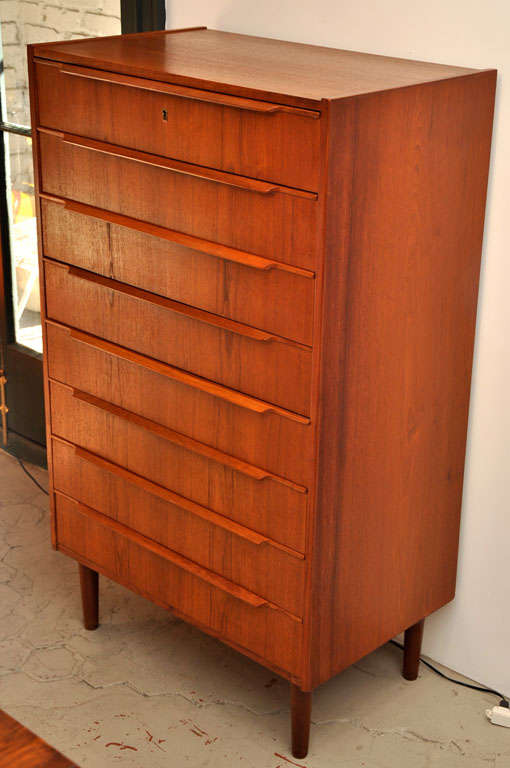 1960's teak chest with eight cedar lined drawers and a locking top drawer.