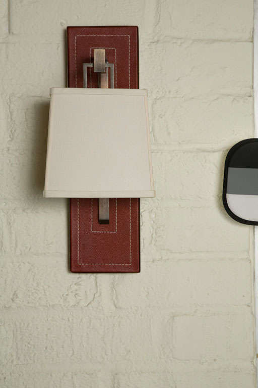 Paul Marra Leather Back Sconce with Tapered Linen Shade. Shown in red. COL 2 sq ft per sconce.