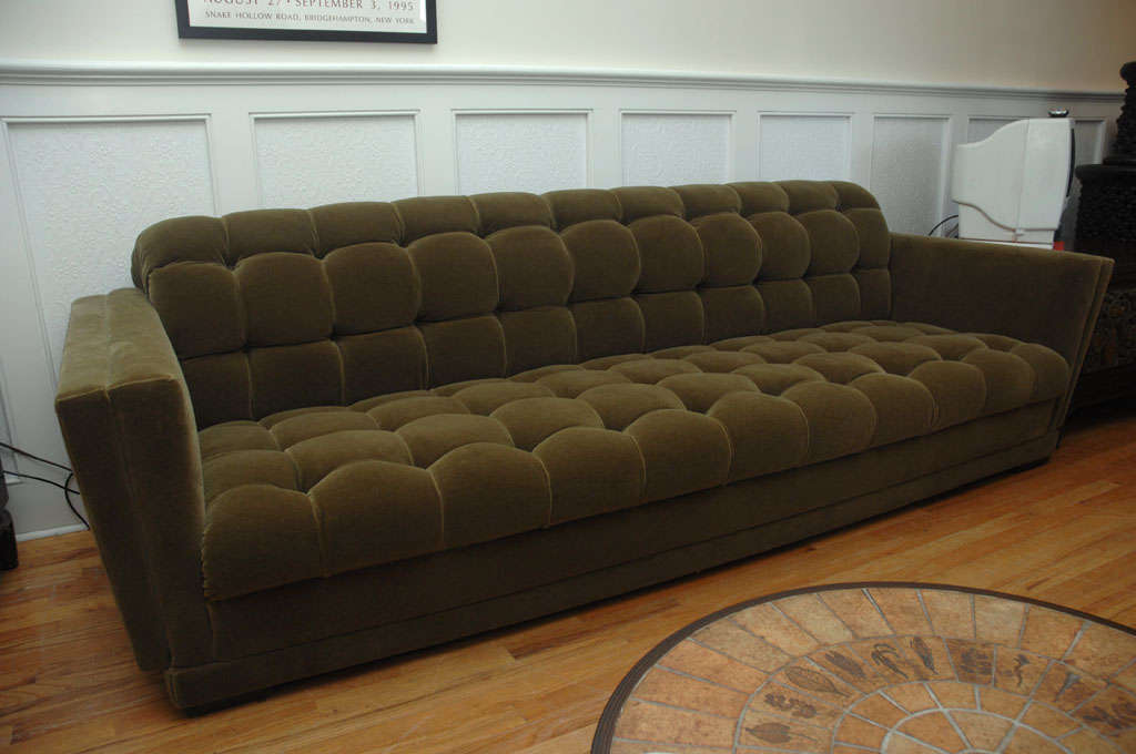 An elegant and generously proportioned sofa designed by JAMES MONT<br />
This beautiful sofa has been fully restored and upholstered in a moss green mohair velvet fabric