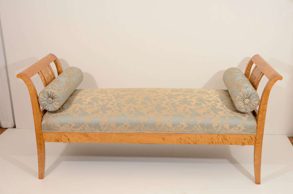 A sturdy, elegant settee, of highly figured Nordic birch, finished on all sides.