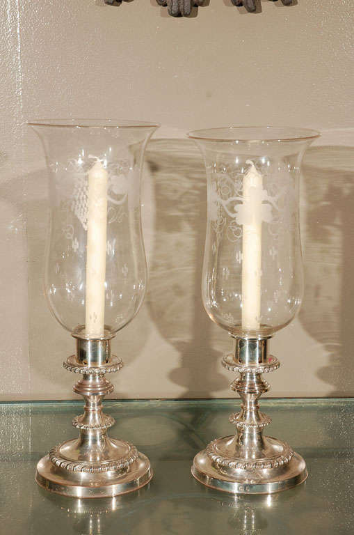 A pair of English Old Sheffield Silver Hurricane Candleholders with Hand Blown and Etched Shades in a Foliage Pattern