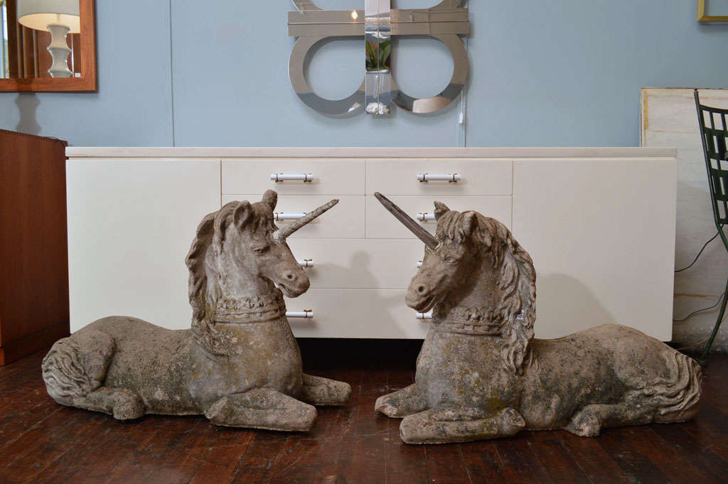 Lovely pair of garden statuary composite stone unicorns. Very large and impressive. Please note, one horn has been replaced with wood.