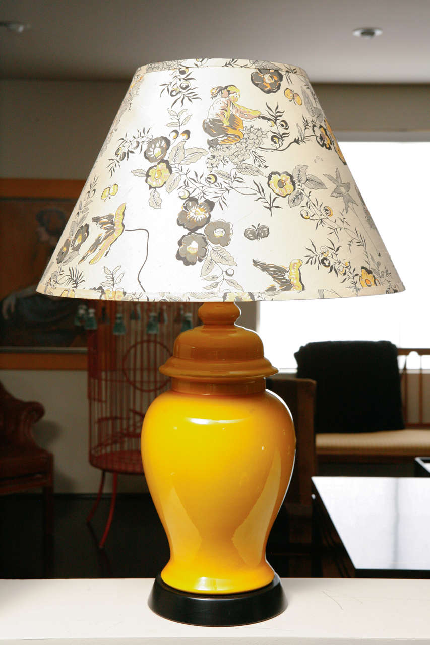 Beautiful pair of midcentury table lamps with yellow ceramic ginger jar body and oil rubbed bronze colored base. One-of-a-kind custom silk shade with chinoiserie motif.