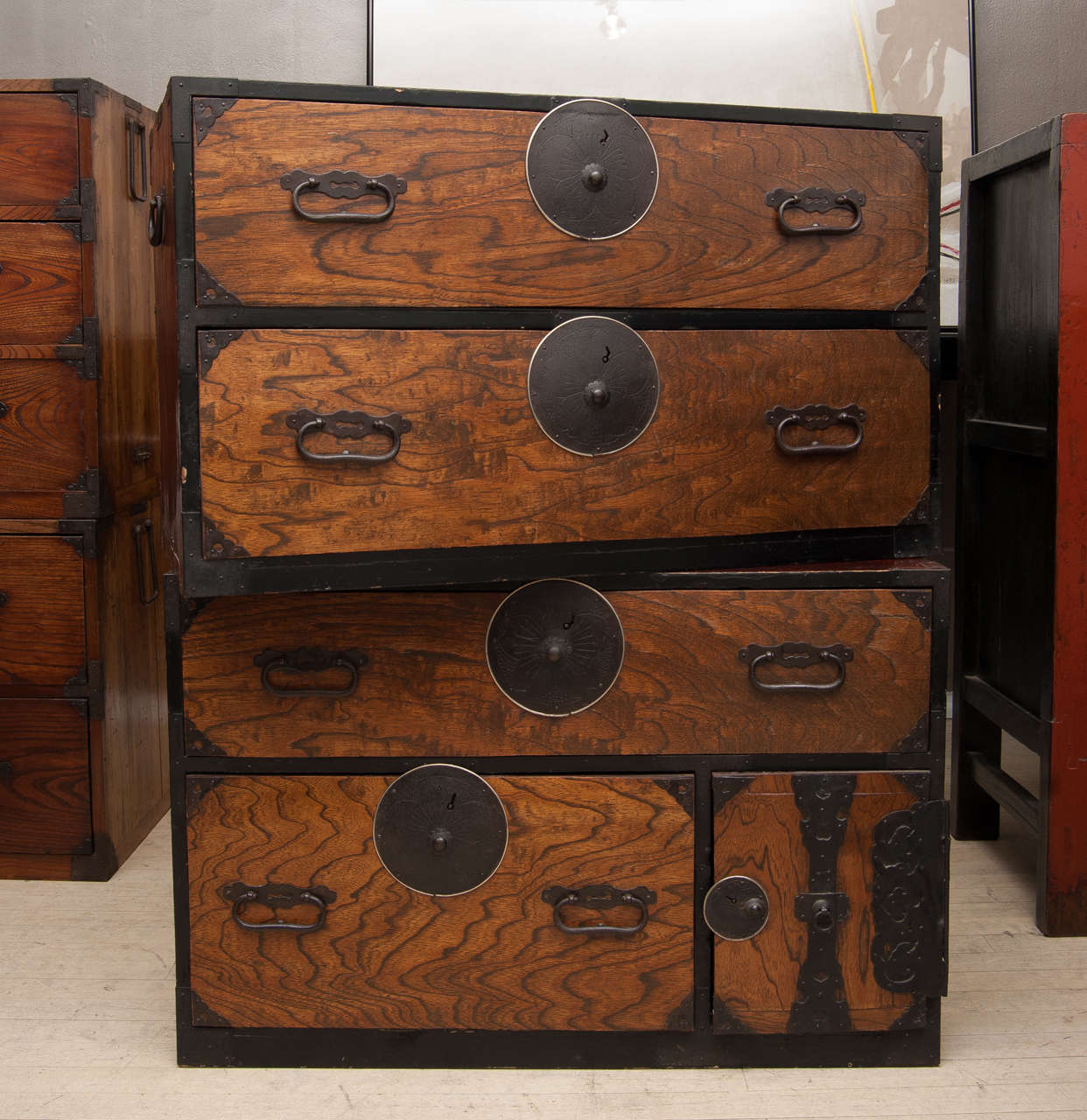 Two section, strikingly grained chesnut wood tansu with hand forged iron and bronze harware in the traditional