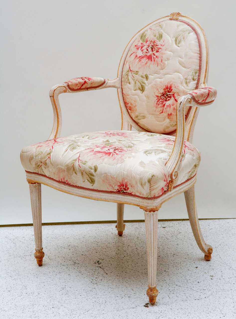 A feminine fauteuil designed by William Haines for the estate of Eddie Chiles in Ft Worth, Texas. The faux painted armchair retains its original quilted floral fabric, as it was designed for Mrs. Chiles' bedroom.