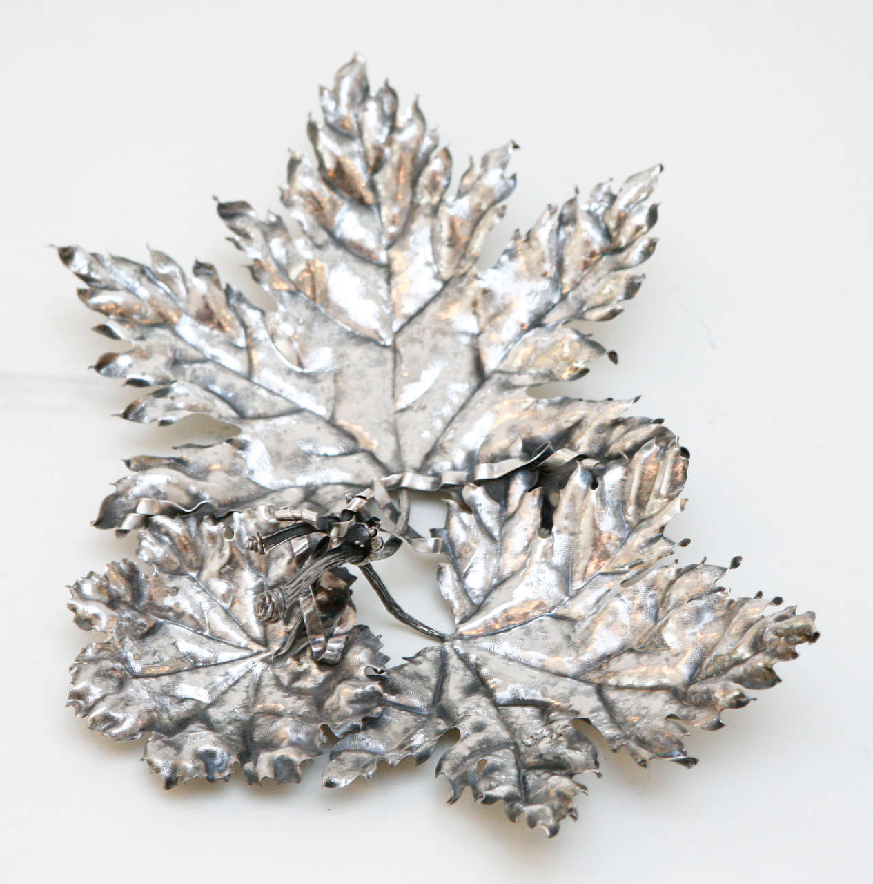 A beautiful sterling silver Italian maple leaf dish by Buccellati with three leaves 