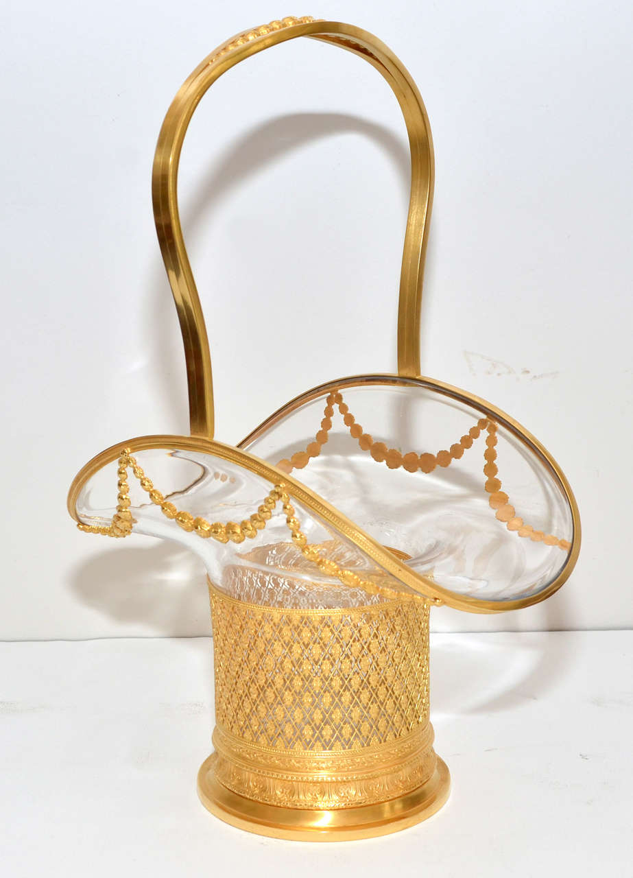 shapely crystal basket , set in gilded bronze very finely chiselled.