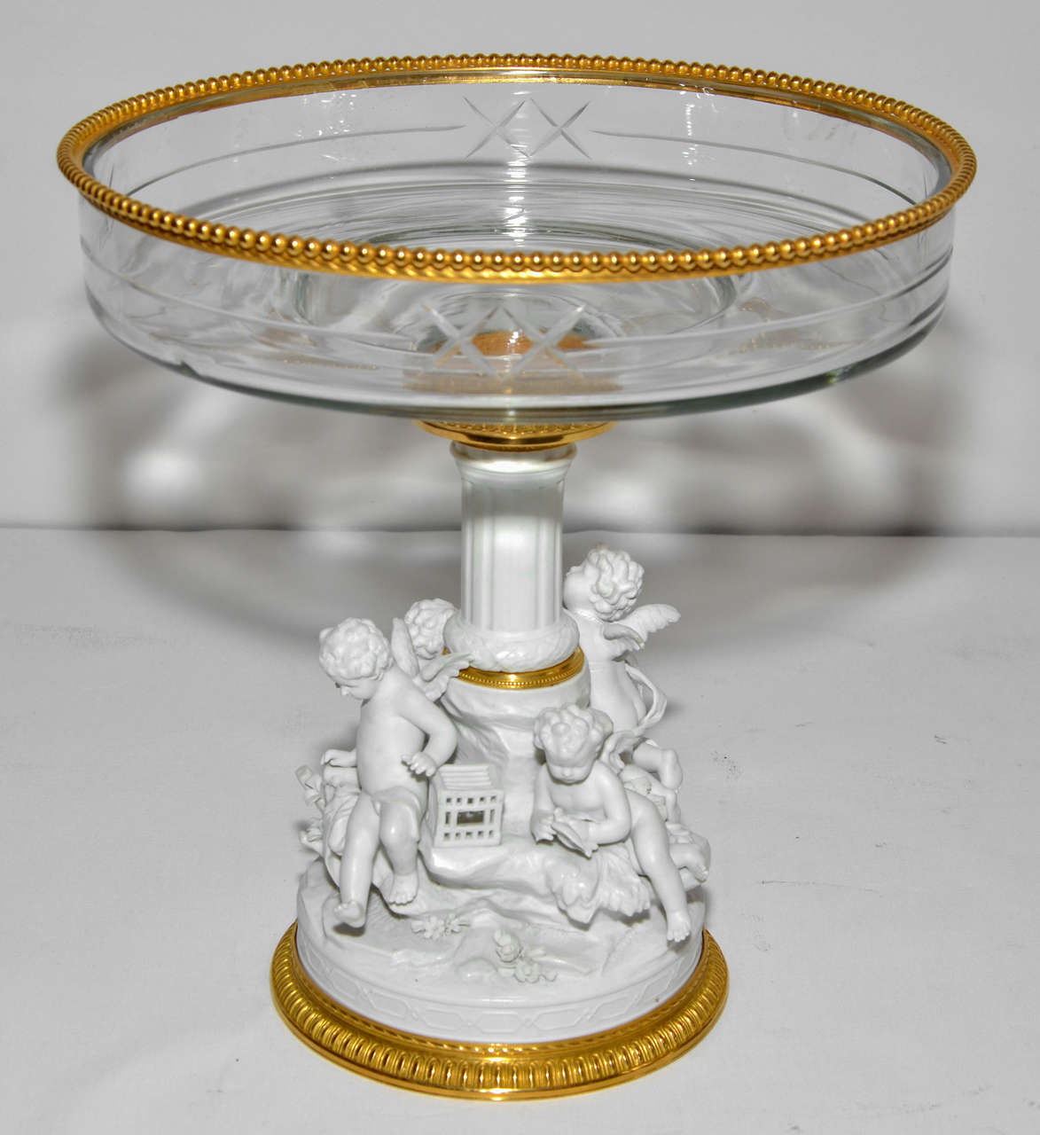 Very rare crystal bowl standing on a bisquit foot, representing children 
This cup is set by fine gold bronze.

 diameter of the base 7 inches