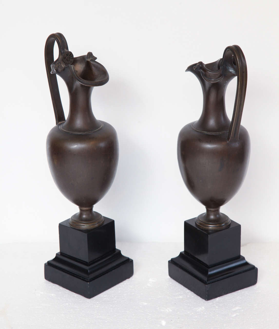 Bronze Pair of 19th Century Classical Ewers on Marble Plinths