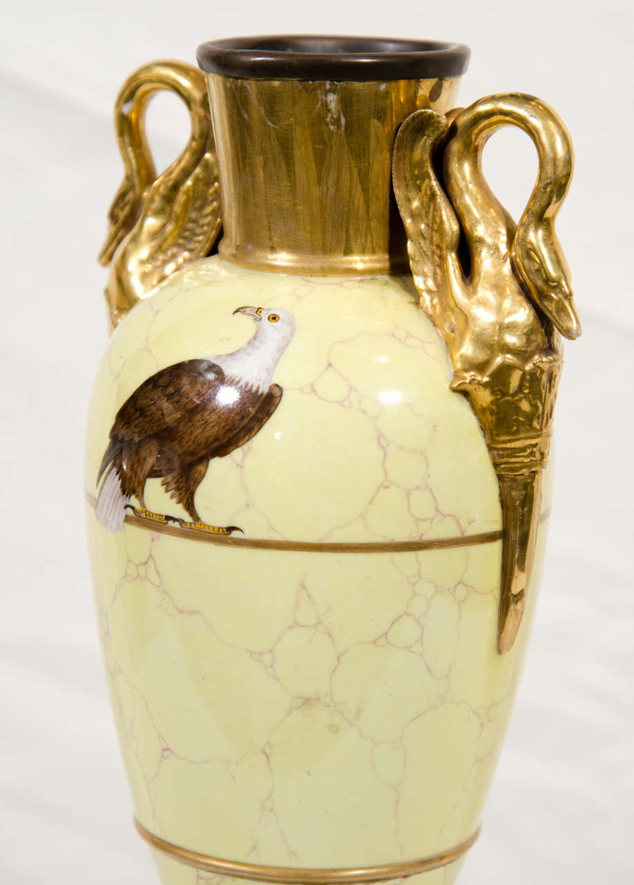 A Gilded Vase with an Eagle on a Marbleized Yellow Ground