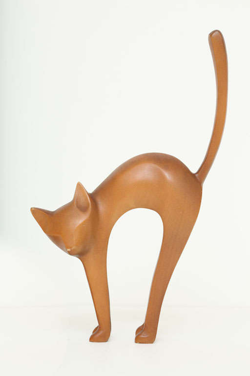 Wonderful stretching cat sculpture by Hagenauer. Expertly carved from a single piece of wood. Signed 