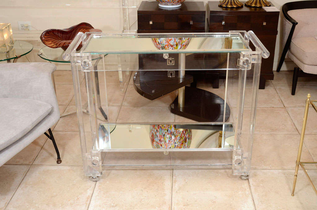 American Lucite rolling cart featuring two mirrored shelves
