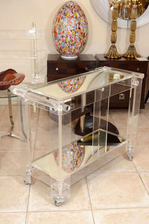 Lucite rolling cart featuring two mirrored shelves 2