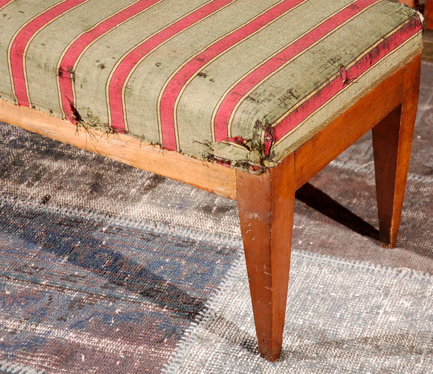A pair of benches with original fabric on elegant tapered leg frames. From the Veneto region.