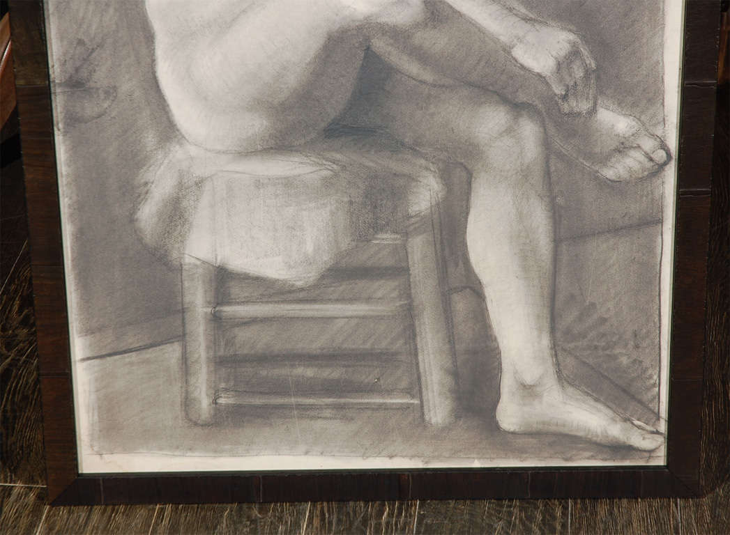 A beautiful charcoal drawing of a seated male nude in a modern custom frame. Signed upper right (illegible).