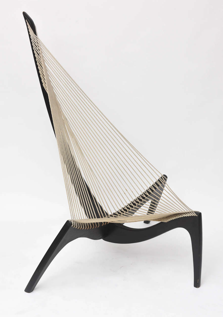 Original, 1960s edition Harp chair, designed by Jorgen Hovelskov. Inspired by the prow of a Viking ship, and still an evocative piece for your seaside getaway! Ebonized wood and flag halyard line.