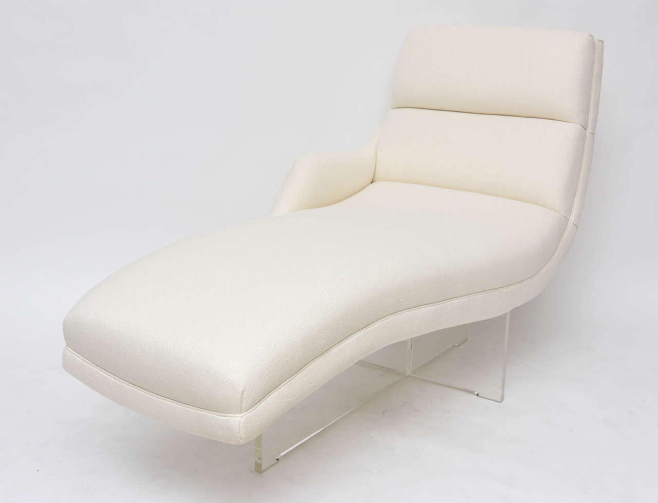 Curvy, sexy, left-arm Erica lounge chair by Vladimir Kagan. Acrylic base, upholstered in rich, creamy silk.