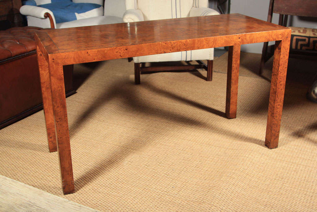 A mid 20th century burlwood Parsons table.