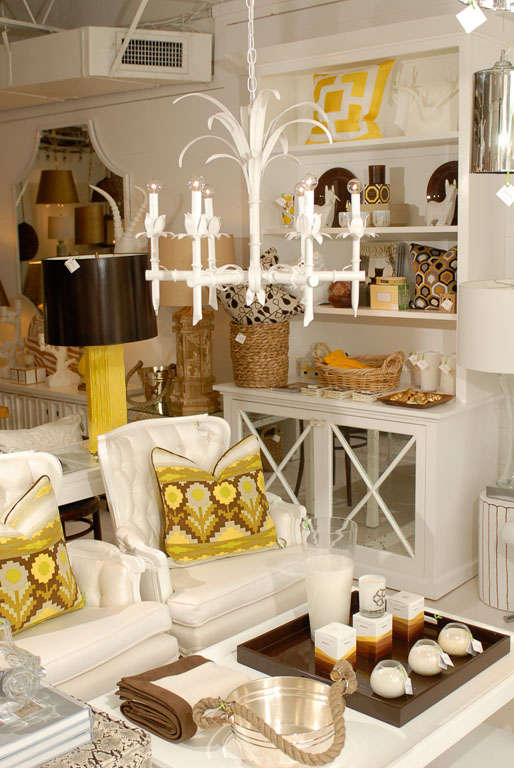 * Vintage<br />
* Faux bamboo arms and center column<br />
* Spray of artistic palm leaves in center<br />
* Petal leaf candle holders<br />
* Newly painted white semi gloss<br />
* New wiring added<br />
* Holds six candelabra 60 watt