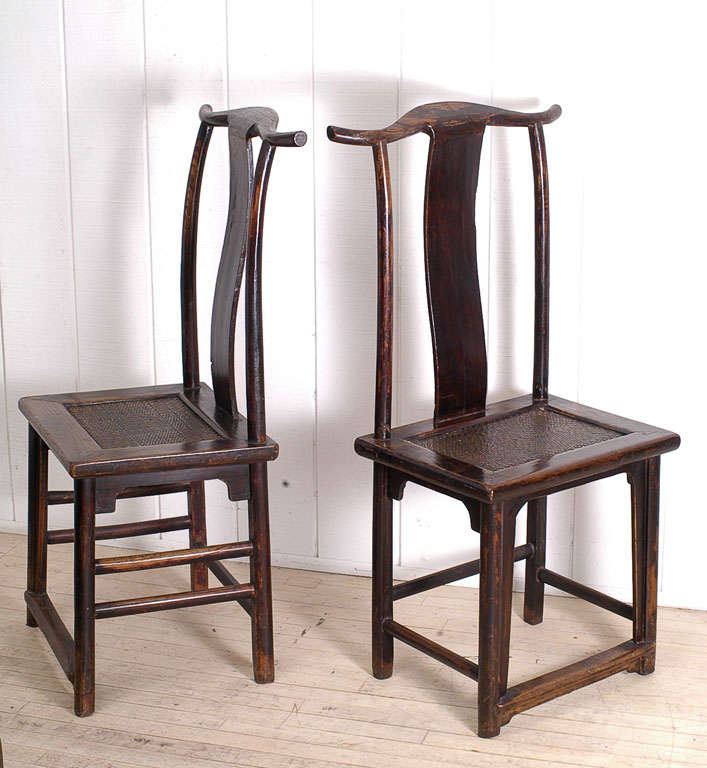 Pair of Chinese Yoke Back Side Chairs, Elmwood with Hard Cane Seats.The chairs are in original condition retaining a beautiful color and compelling patina.