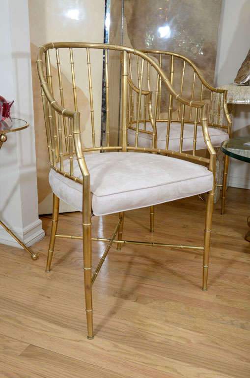 Pair of upholstered brass faux bamboo arm chairs.<br />
<br />
View our complete collection at www.johnsalibello.com