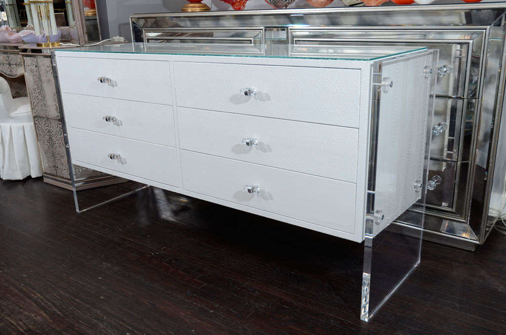 6-drawer white python dresser with Lucite side panels. Customization is available in different sizes and colors.