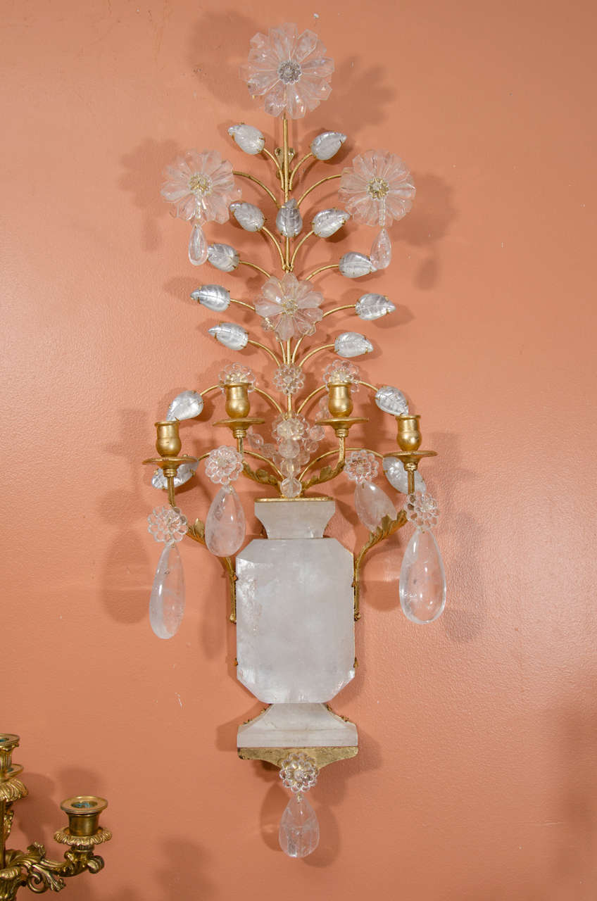 A pair of Bagues style rock crystal four light sconces