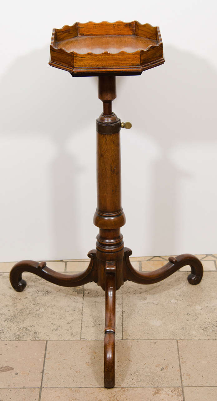 An unusual mahogany adjustable urn stand.
