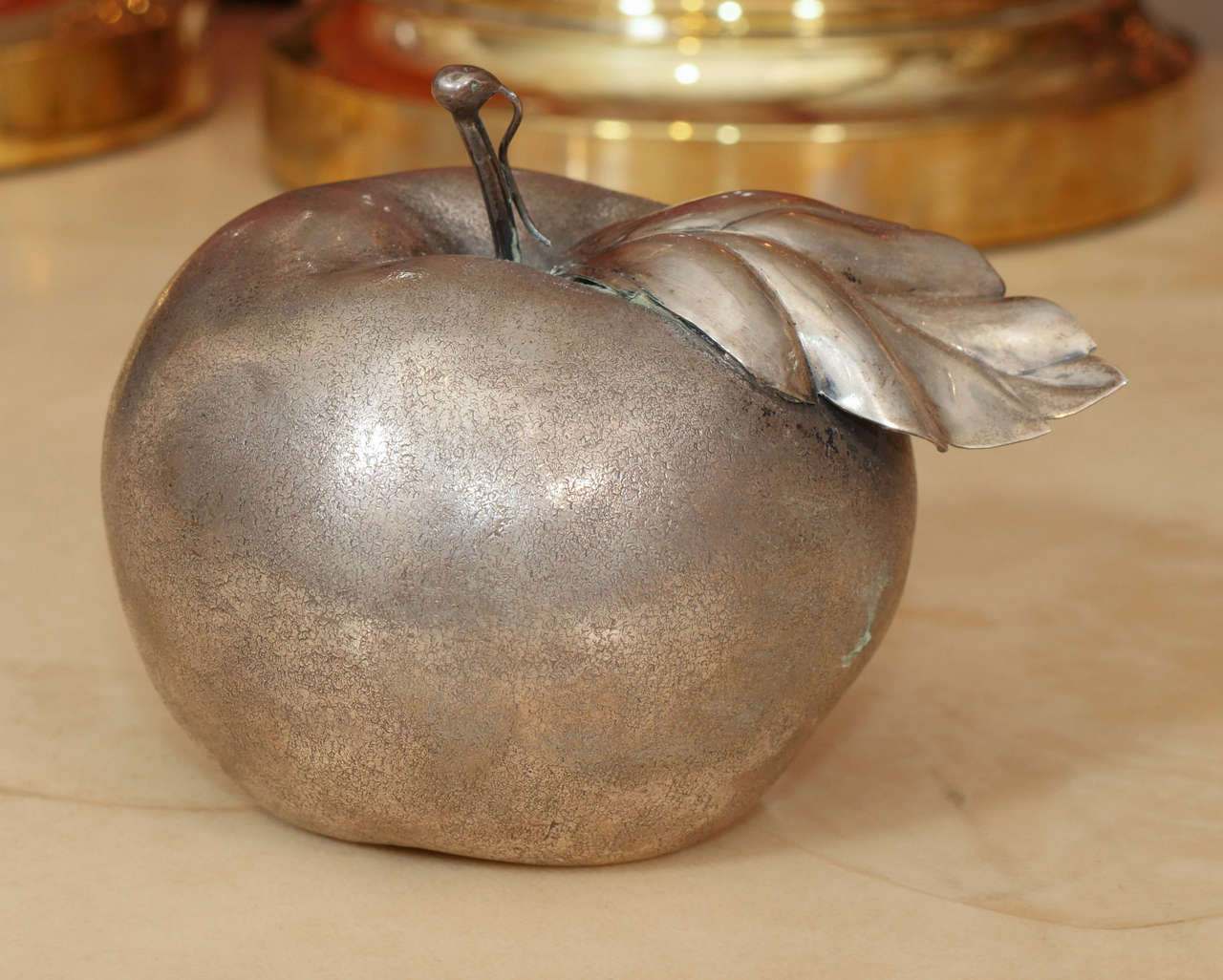 Sterling silver apple with concealed lighter in base by Buccellati.