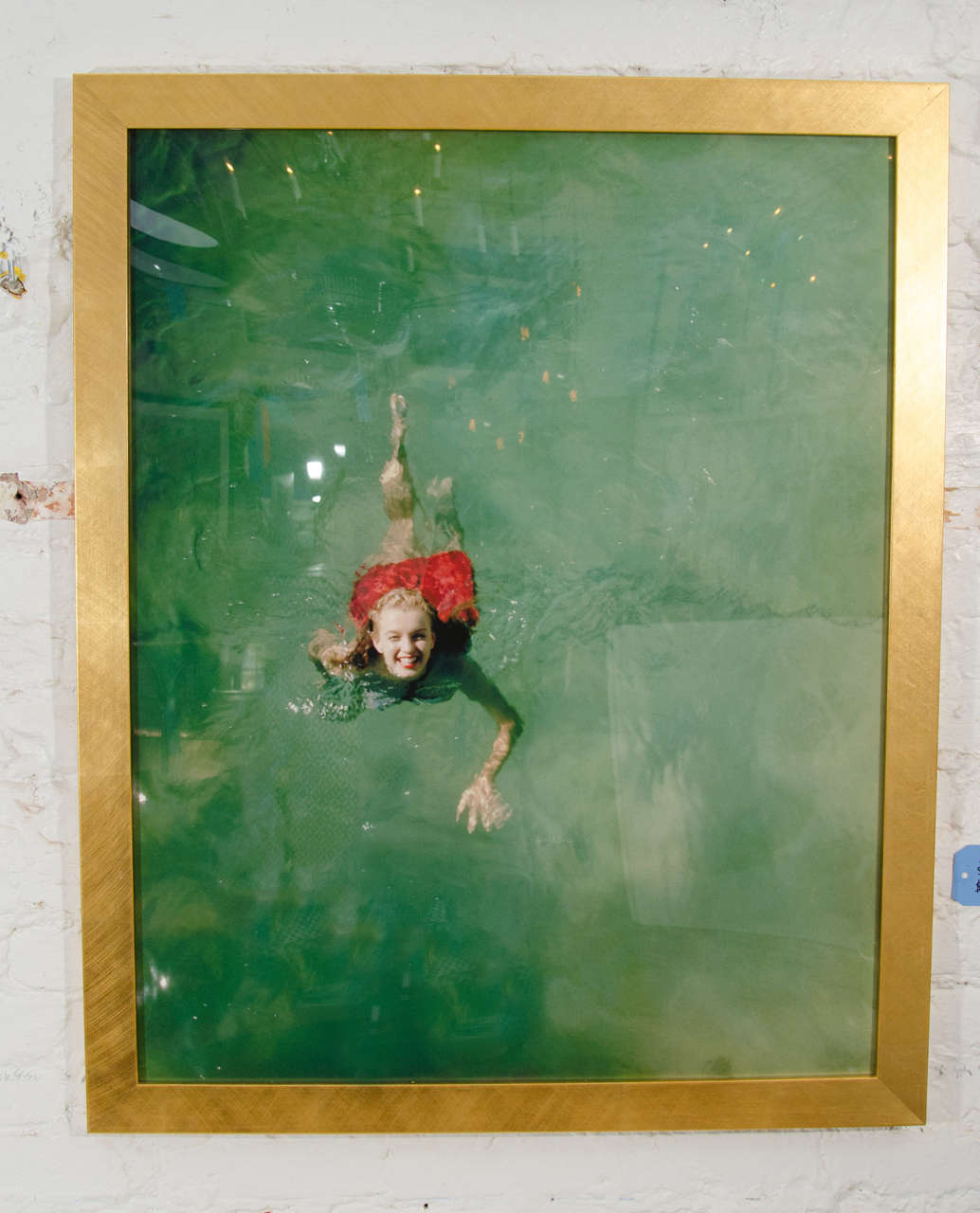 High resolution print on archival paper, framed with flat gold wood frame.
