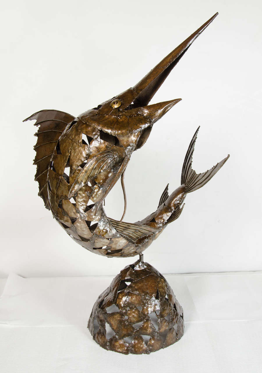 Mid-Century Modernist brutalist free-form manner Marlin sculpture in copper patinated steel.  The body of the sculpture and base are comprised of triangles that are in an overlaid design that create the shapes.  The Marlin sculpture is connected to