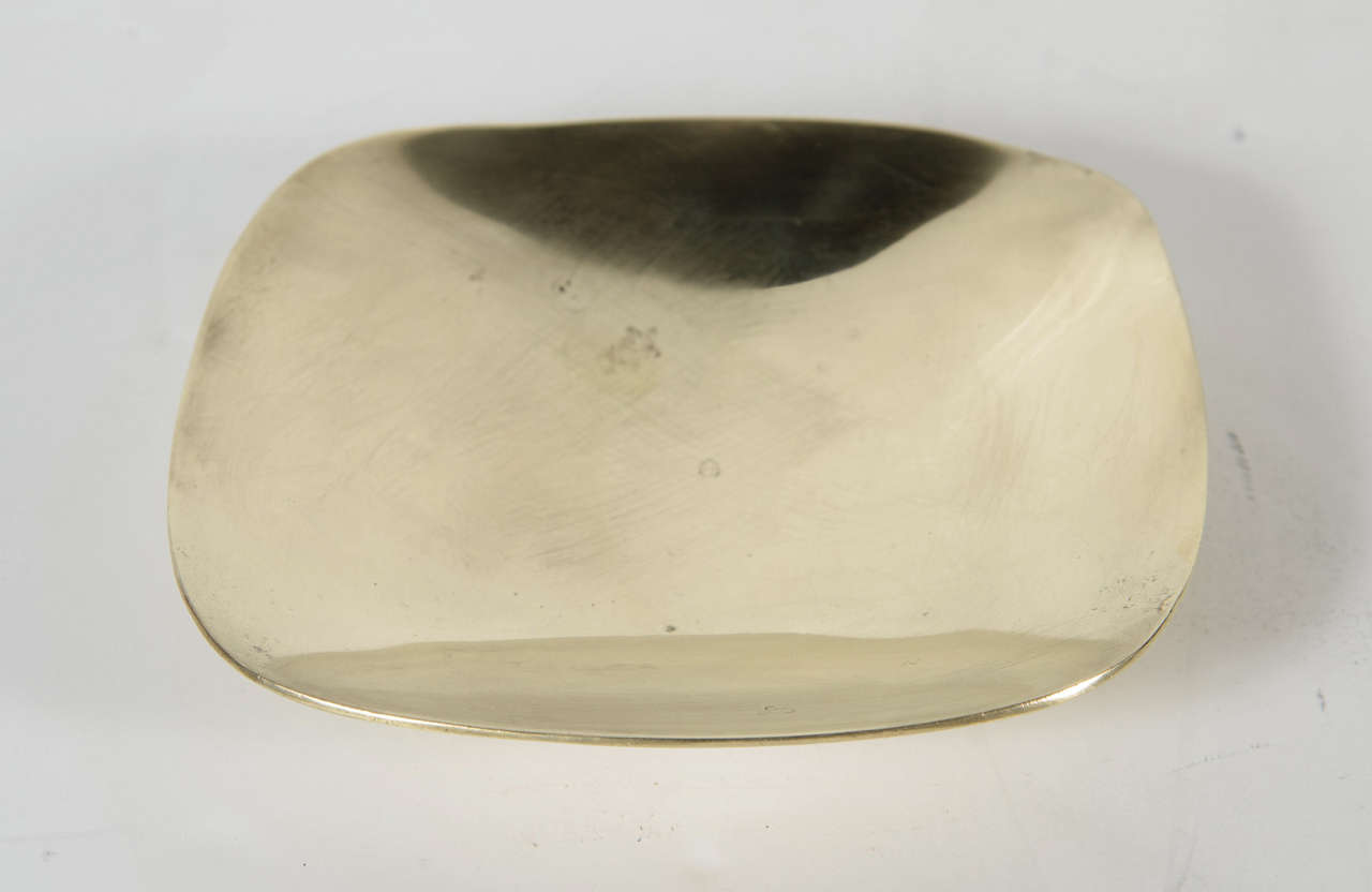 This beautifully made bowl is hand wrought in a square form with rounded edges. It bears Made in Denmark on the back.