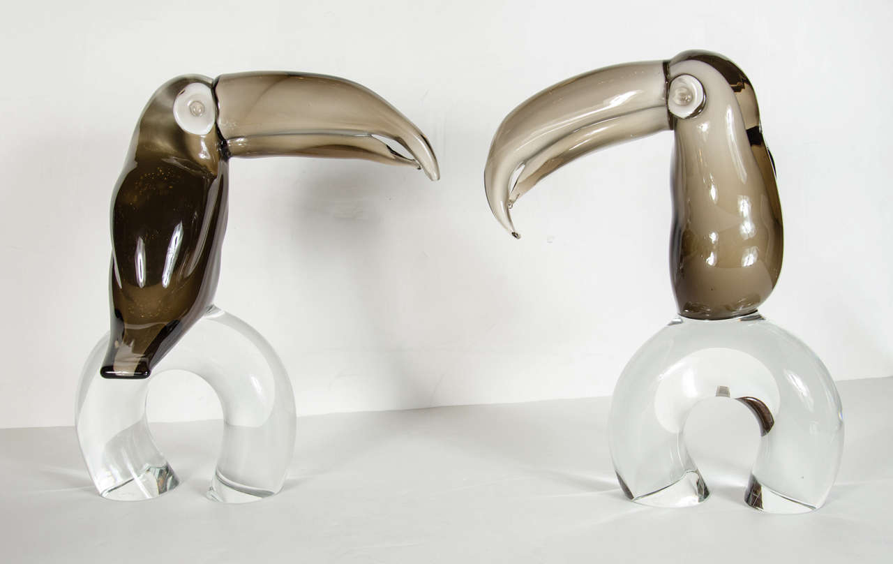 Spectacular smoked and clear hand blown Murano glass executed by hand in the best tradition of one of the great masters Licio Zanetti. The base of each Toucan is hand signed on the bottom by Licio Zanetti. Licio Zanetti is world-renowned for his